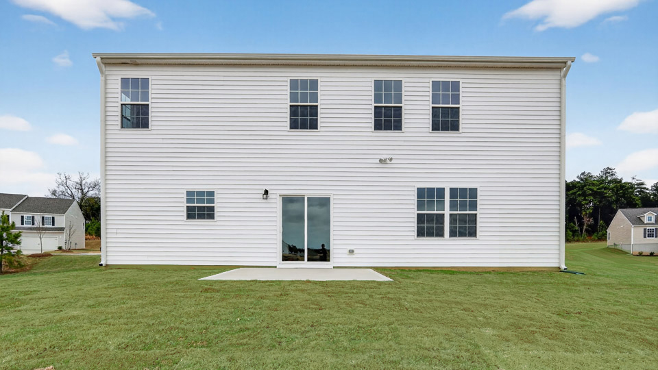back exterior columbia with concrete patio