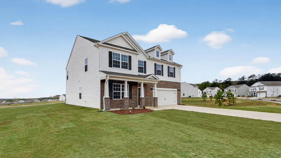 front exterior of Columbia with 2 car garage and large yard