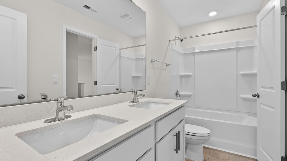 additional bathroom with double vanity sink