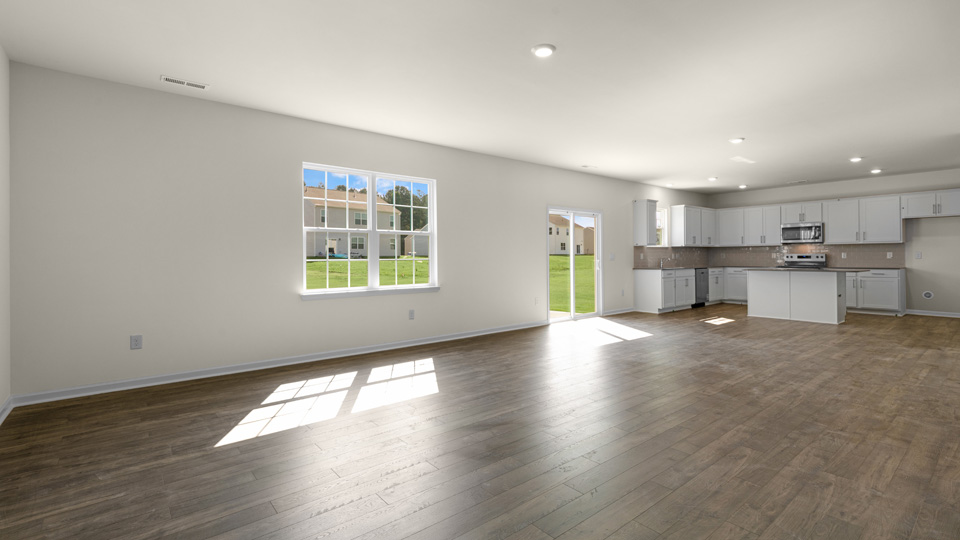 open concept living space with large windows