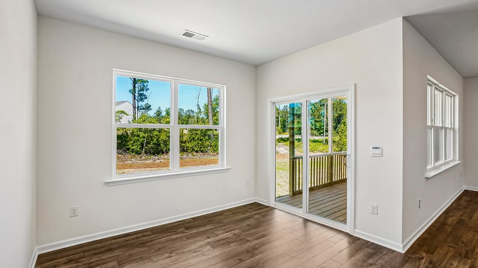 open concept dining space with door to patio