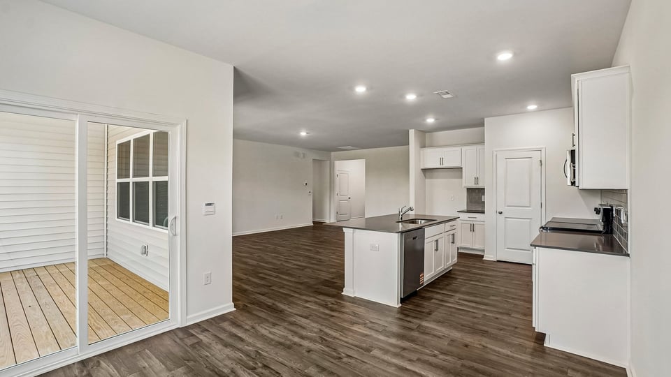 open concept dining space with door to patio