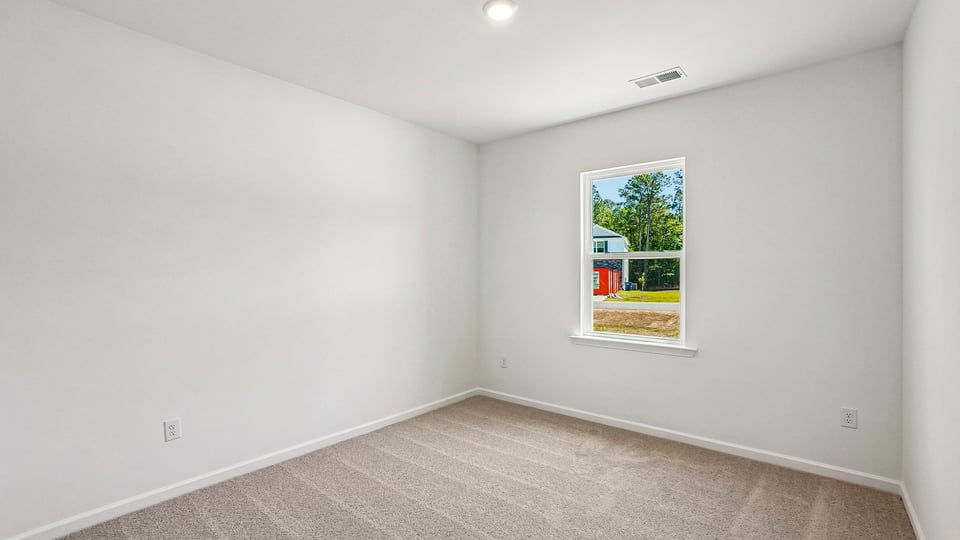 additional bedroom with window, carpeting, closet