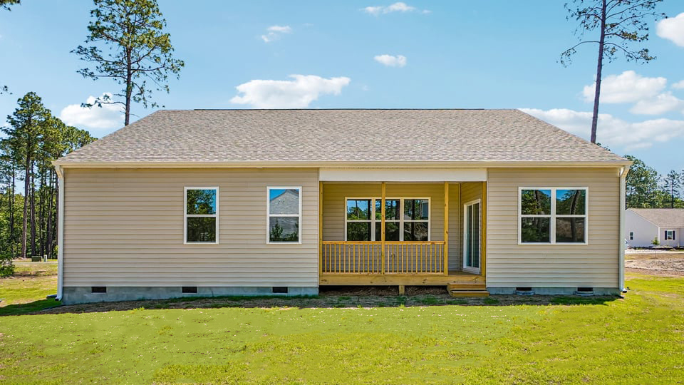 back exterior of booth with patio with covered enclosed deck