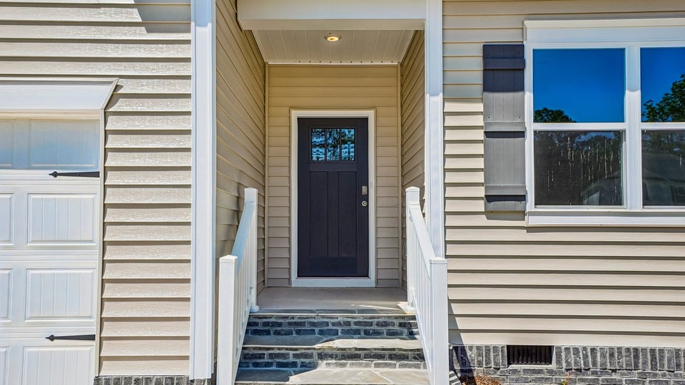 front door exterior with steps leading to entry