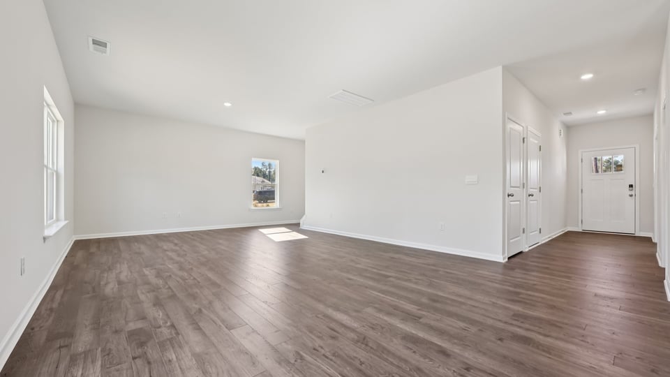open concept living space with large windows