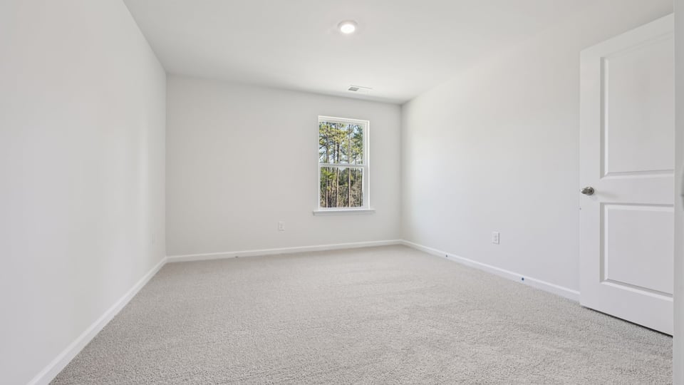 additional bedroom with window, carpeting, closet