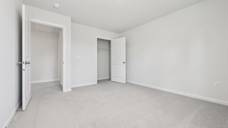 additional bedroom with window, carpeting, closet