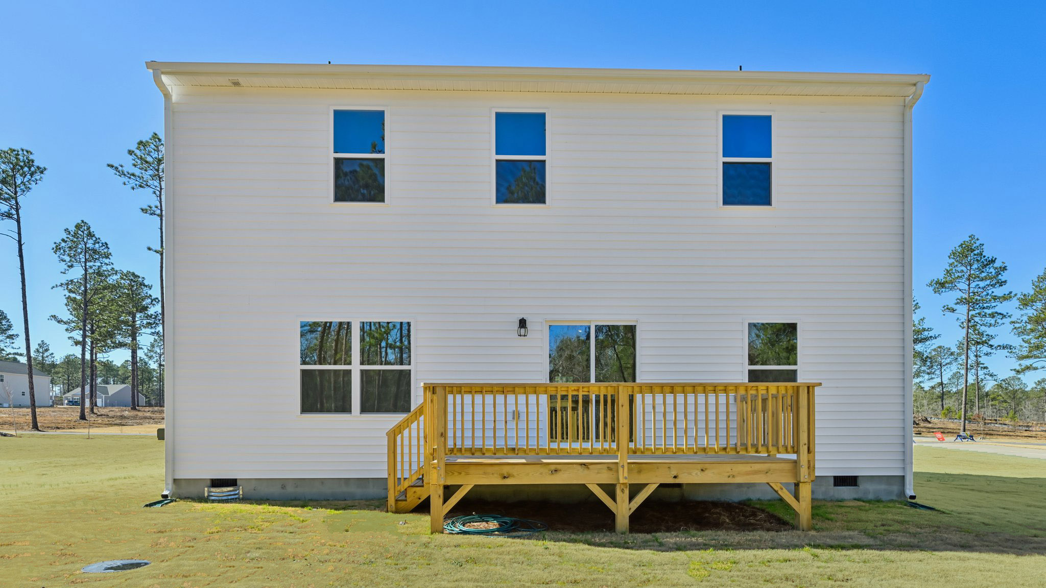 back exterior of galen with deck and open yard