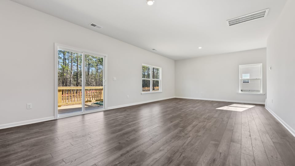 open concept living space with large windows