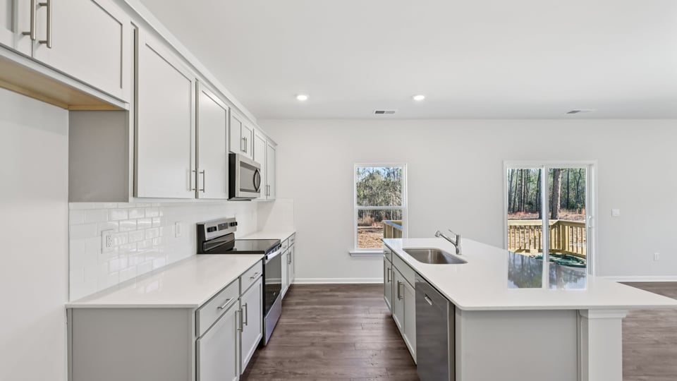 kitchen with gray cabinets quartz countertops and kitchen island