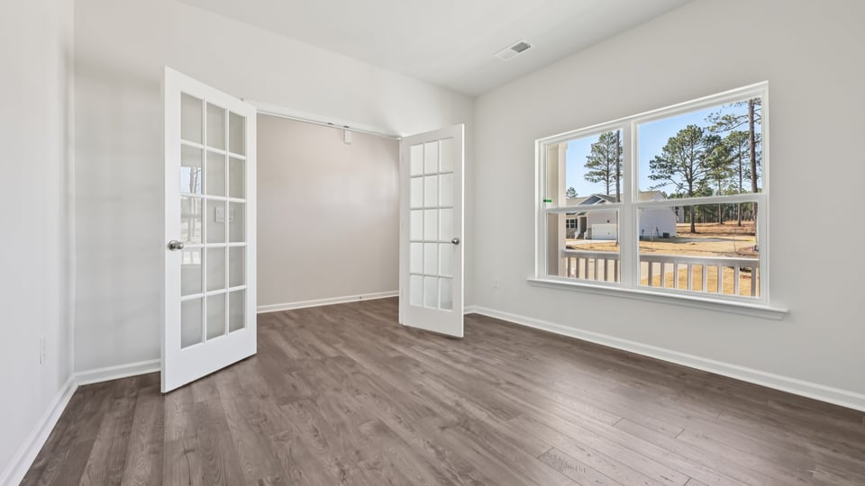 study with glass french doors and revwood flooring