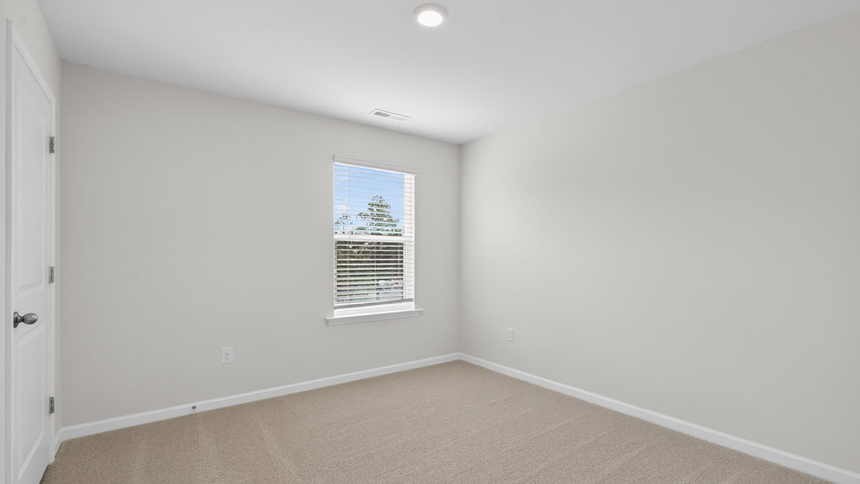 additional bedroom with window, carpeting, closet