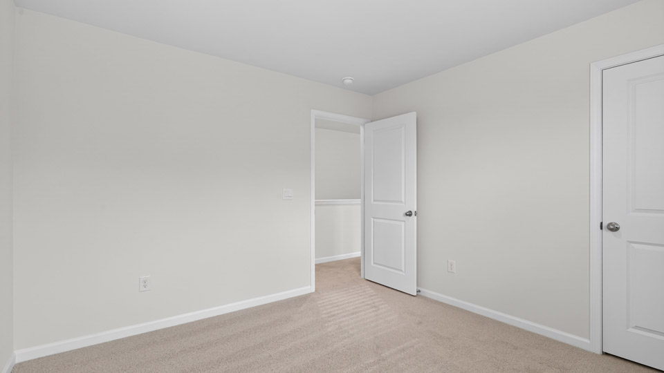 additional bedroom with window, carpeting, closet