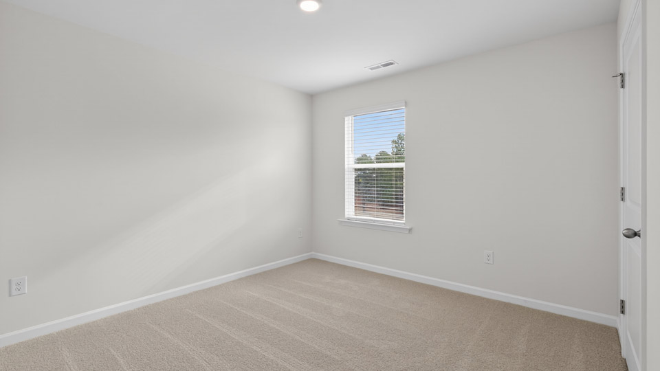 additional bedroom with window, carpeting, closet