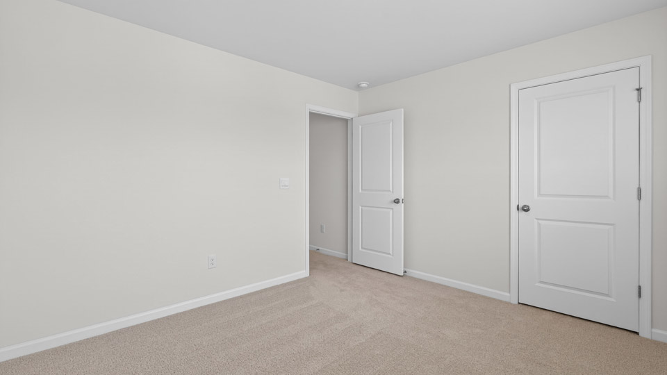 additional bedroom with window, carpeting, closet