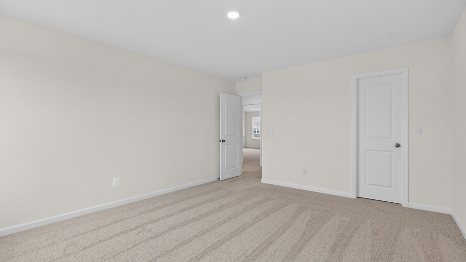 additional bedroom with window, carpeting, closet