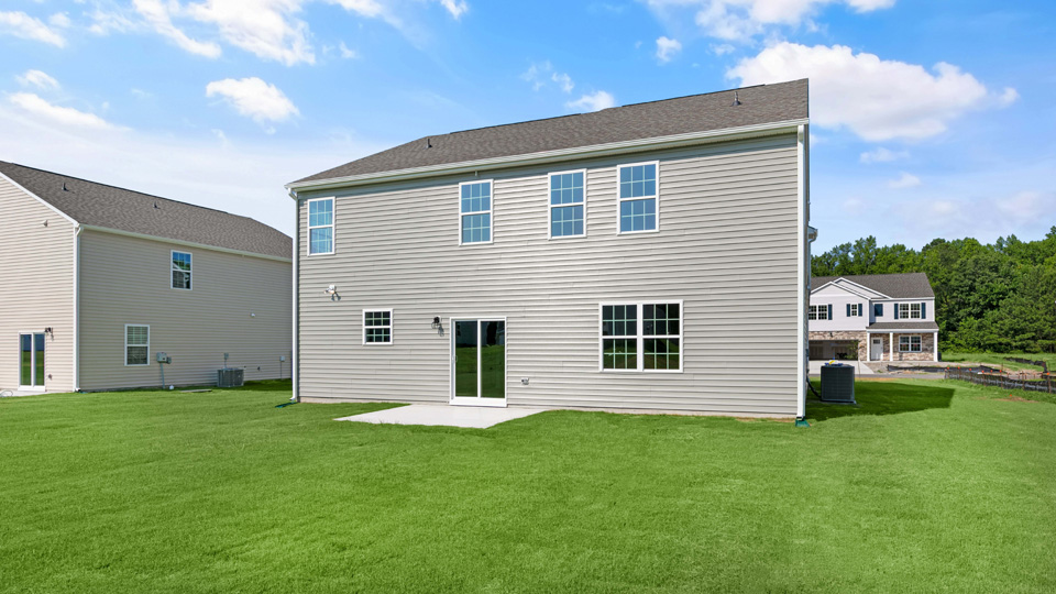 back of columbia with concrete patio