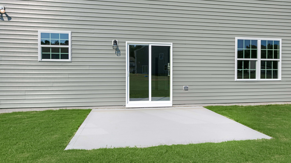back of columbia with concrete patio