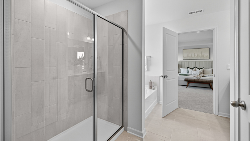 bathroom with walk-in shower with glass doors