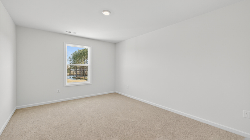 loft with carpet flooring