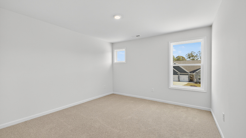 loft with carpet flooring