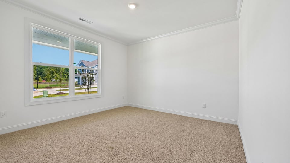 first floor guest bedroom with carpet flooring