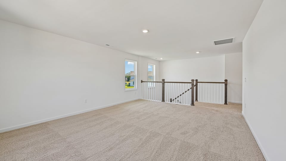 top of stairs at carpeted loft