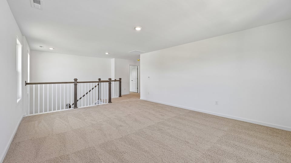 loft with carpet flooring