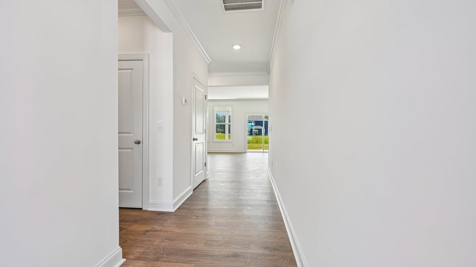 foyer entryway with revwood flooring