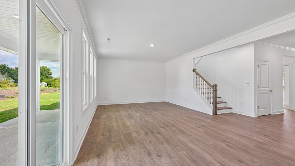 open concept living room with revwood flooring