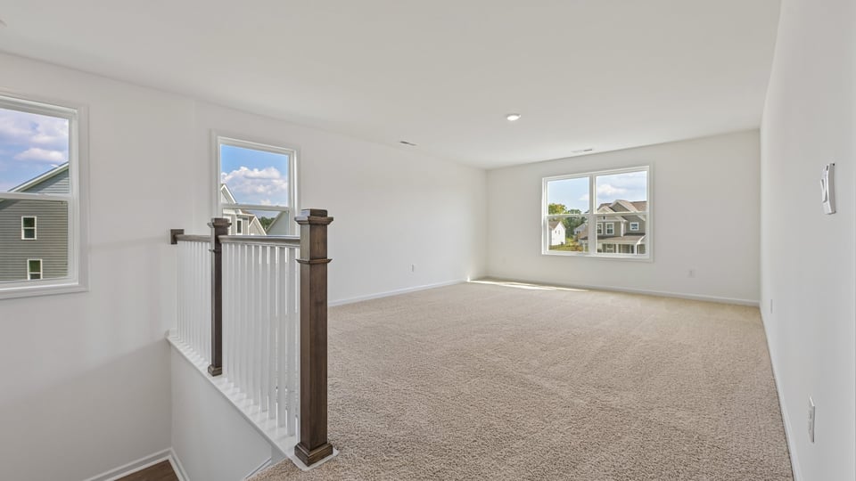 top of stairs at loft with carpet flooring