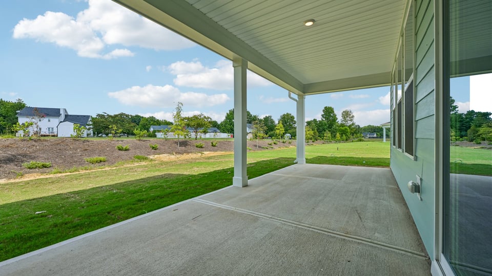 concrete covered patio with sliding glass doors