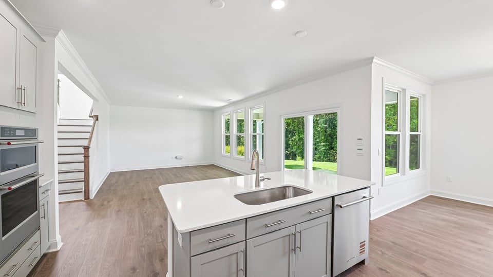 kitchen overlooking open concept living area