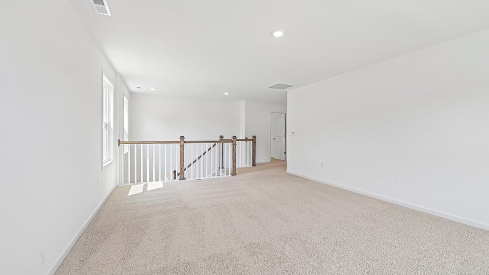 top of stairs at loft with carpet flooring