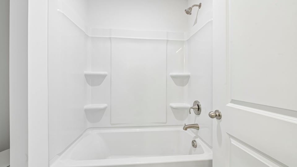 bathroom with tub shower combo