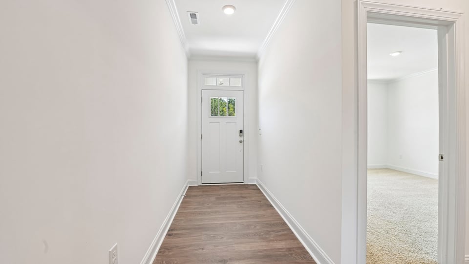 foyer entryway with revwood flooring