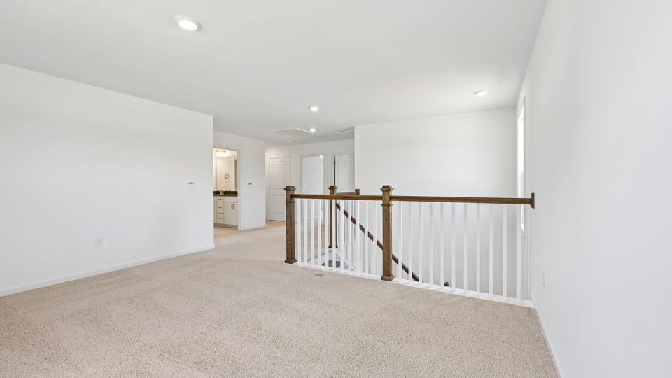 top of stairs at loft with carpet flooring