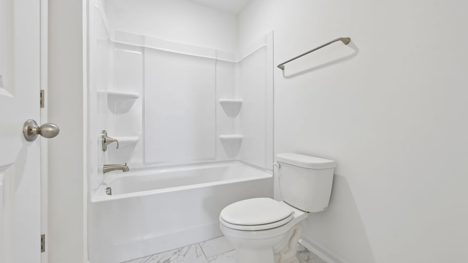 bathroom with tub shower combo