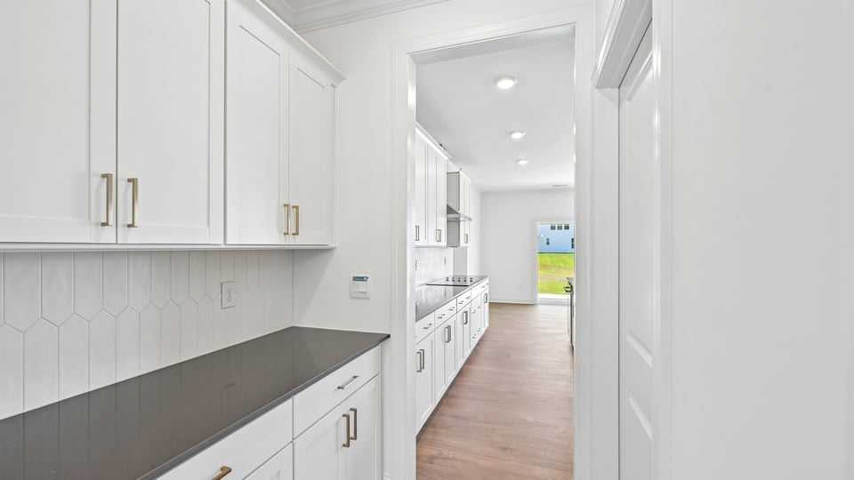 butlers pantry with quartz countertops
