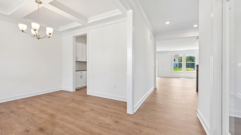dining room with coffered ceiling
