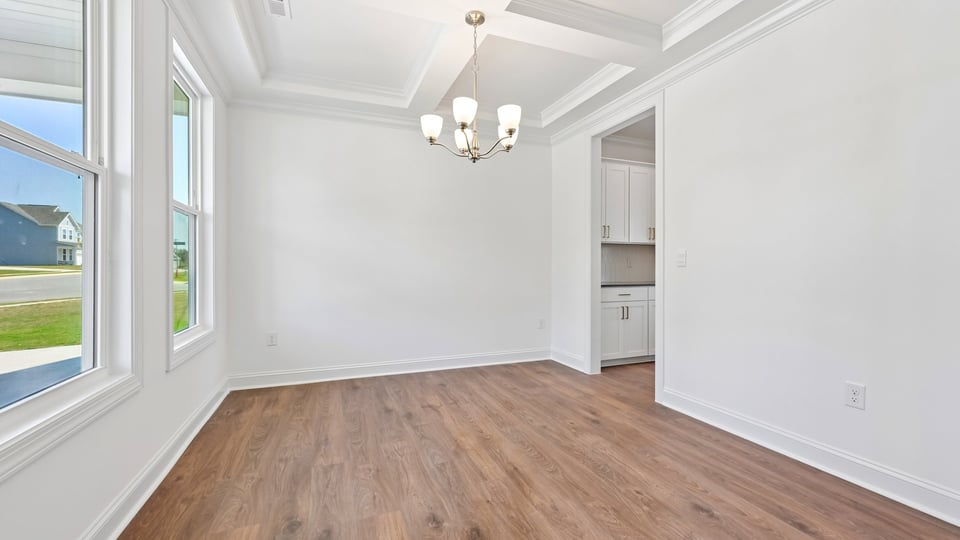 dining room with coffered ceiling