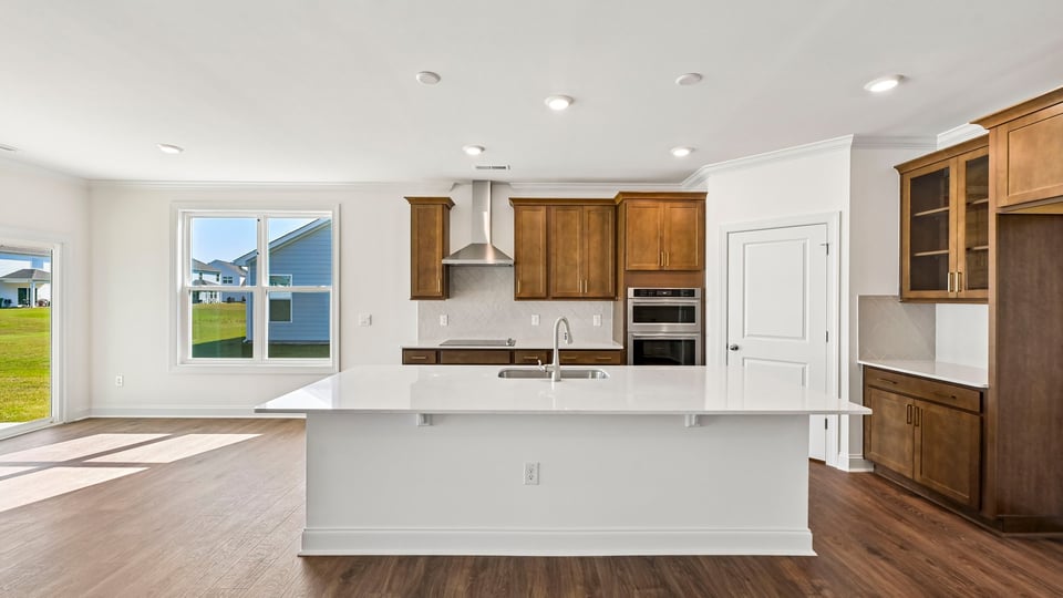 kitchen with spacious center island and brown cabinets