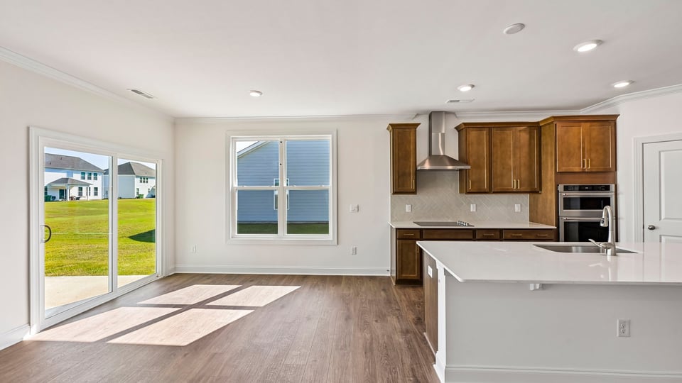 kitchen and breakfast area with sliding glass doors to patio