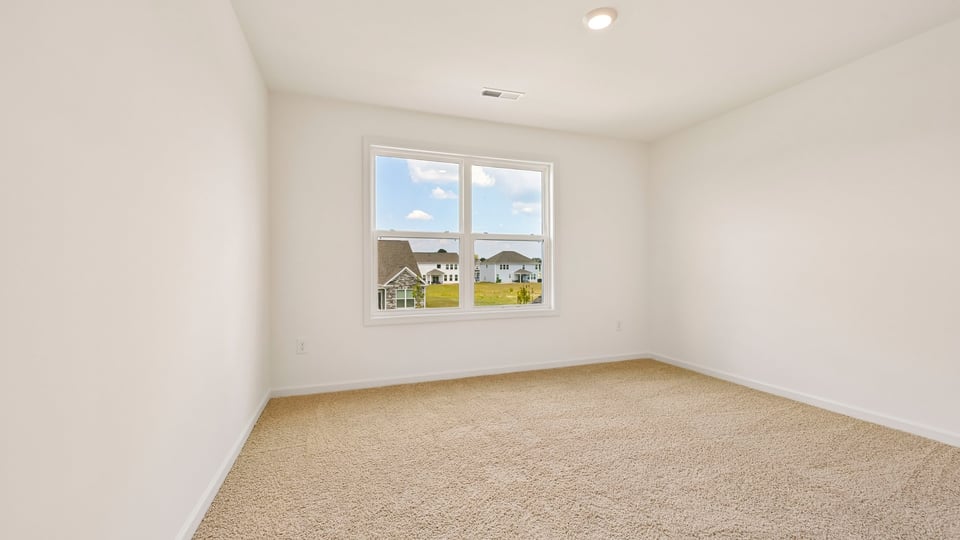 loft with carpet flooring