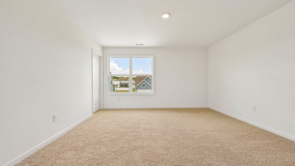 loft with carpet flooring