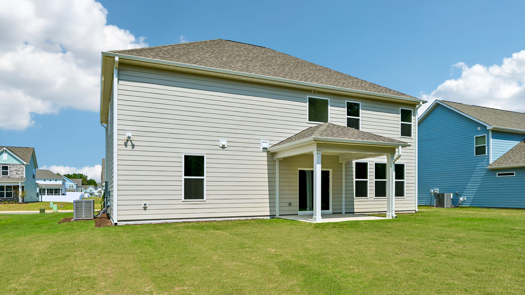 back of home with covered patio