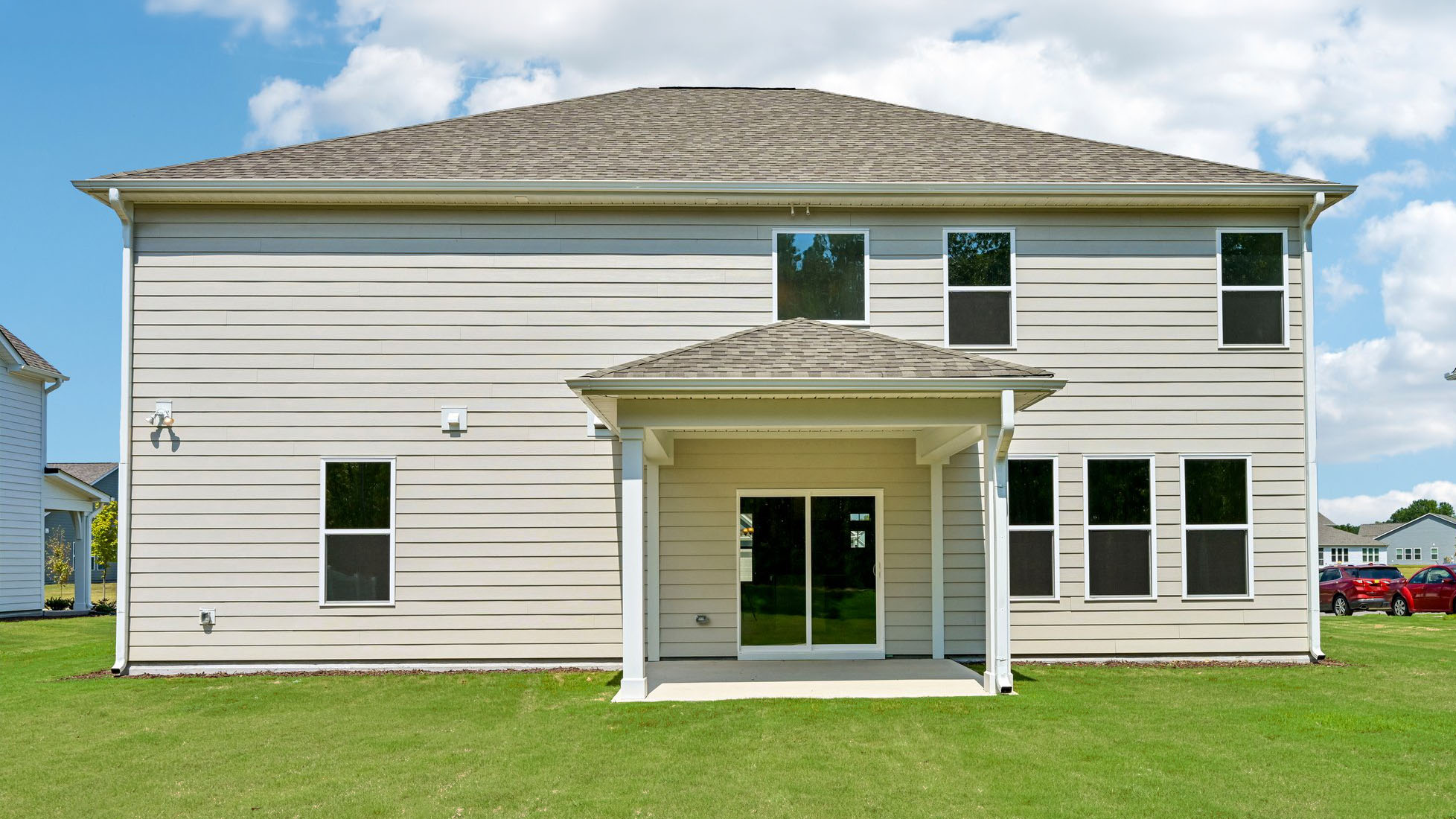 back of home with covered patio