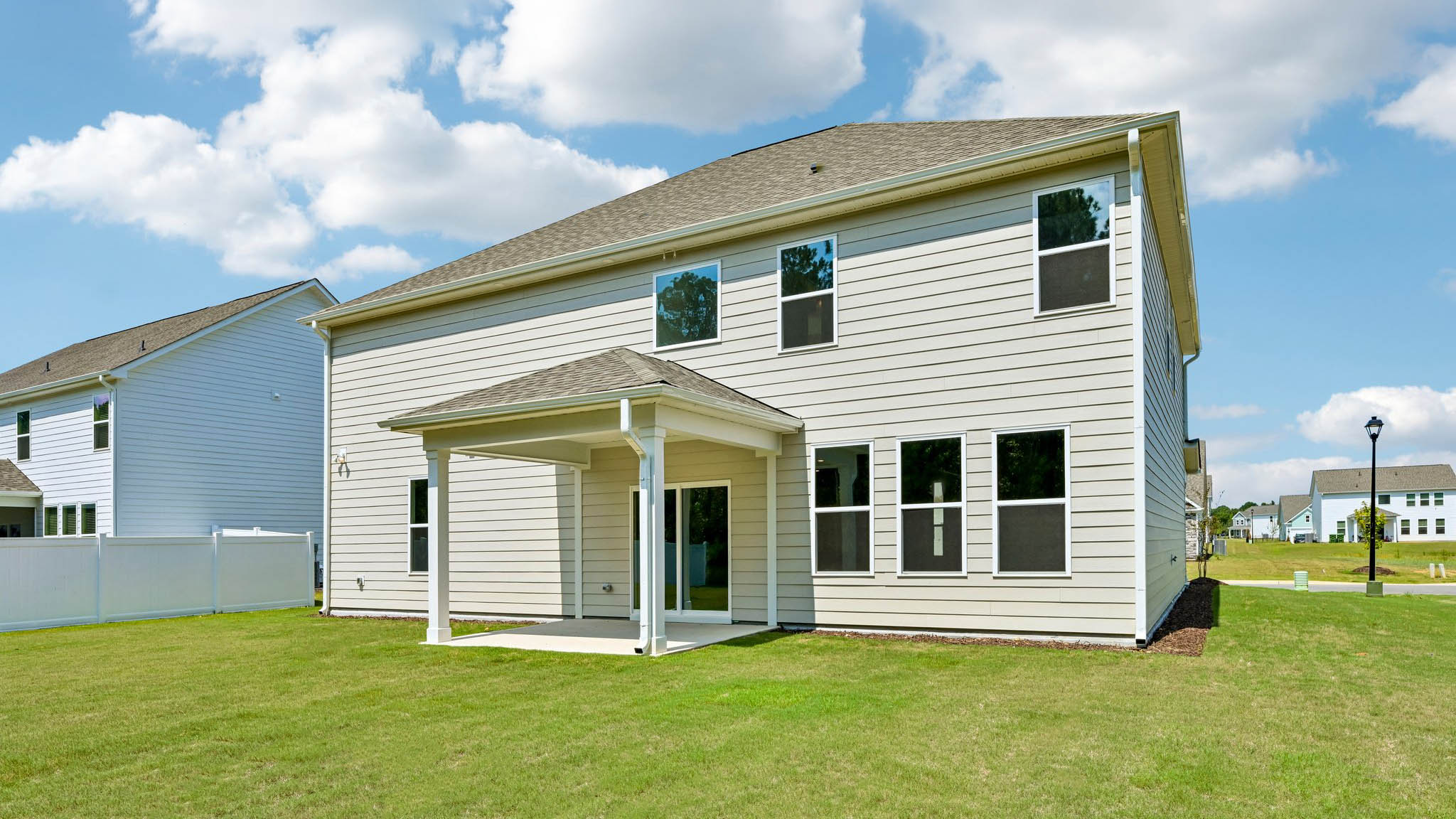 back of home with covered patio