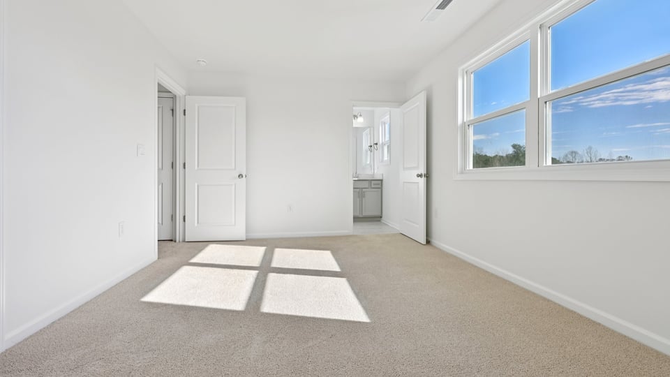 additional bedroom with window, carpeting, closet